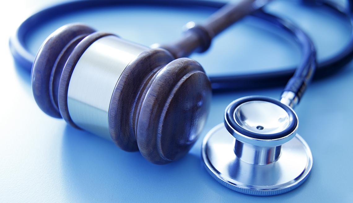 a stethoscope next to a gavel